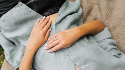 woman lying on back with hands on stomach